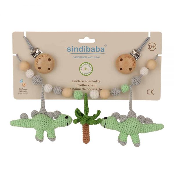 Gehäkelte Kinderwagenkette mit Dinosauriern (grün, Rasselgeräusch) in Verpackung
